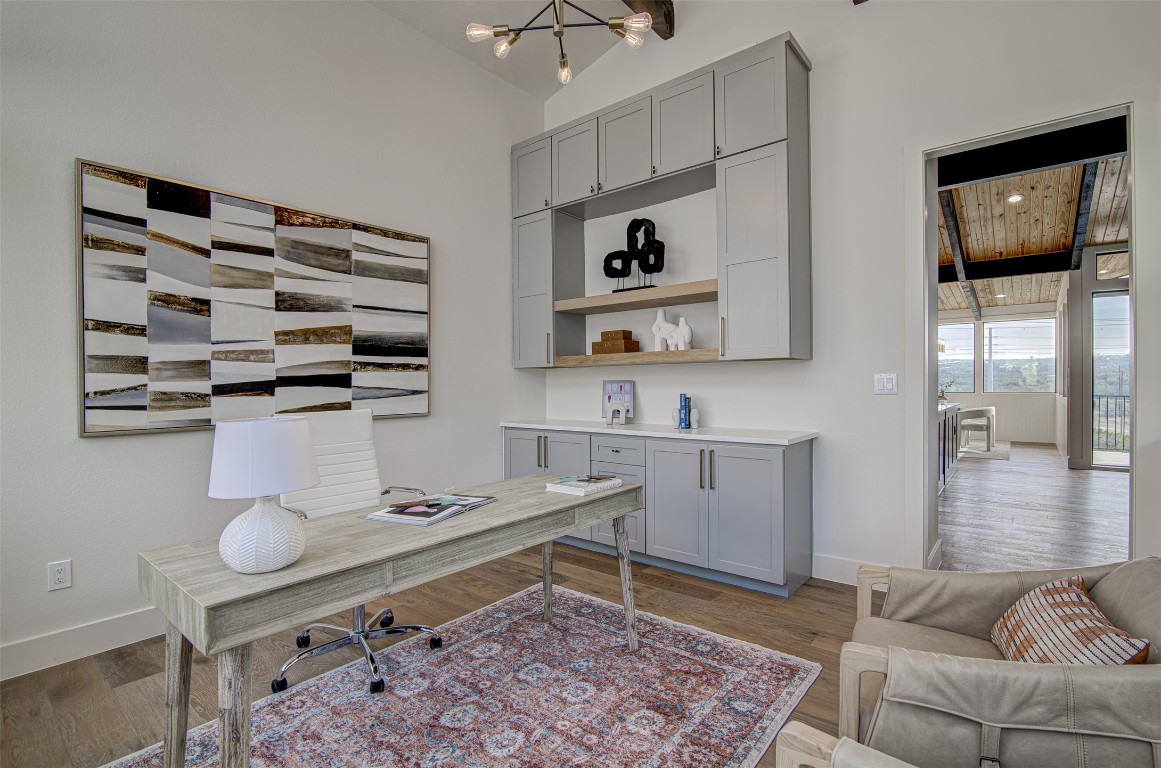 19543 Lakehurst Loop Spicewood, TX 78669 - Photo 7 of 23 a living room with furniture and a flat screen tv