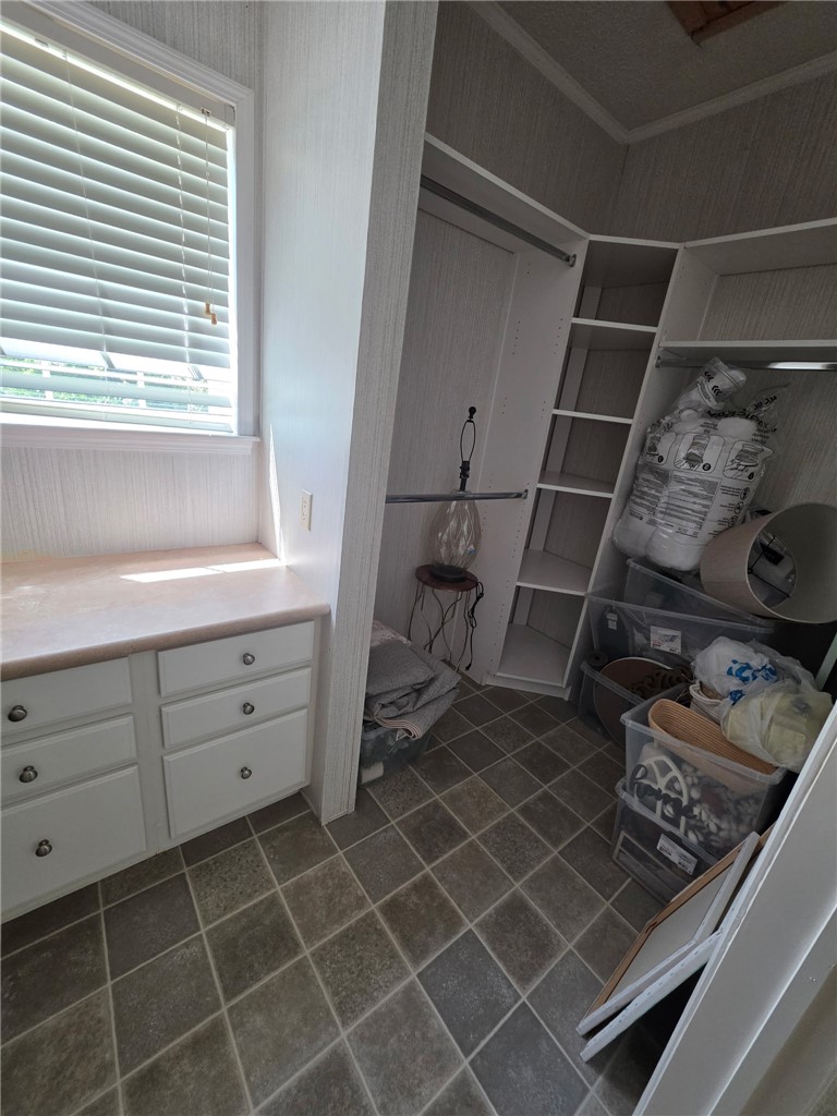 1400 Massey Road Pendleton, SC 29670 - Photo 18 of 25 This spacious closet features ample storage solutions and a convenient built-in countertop.