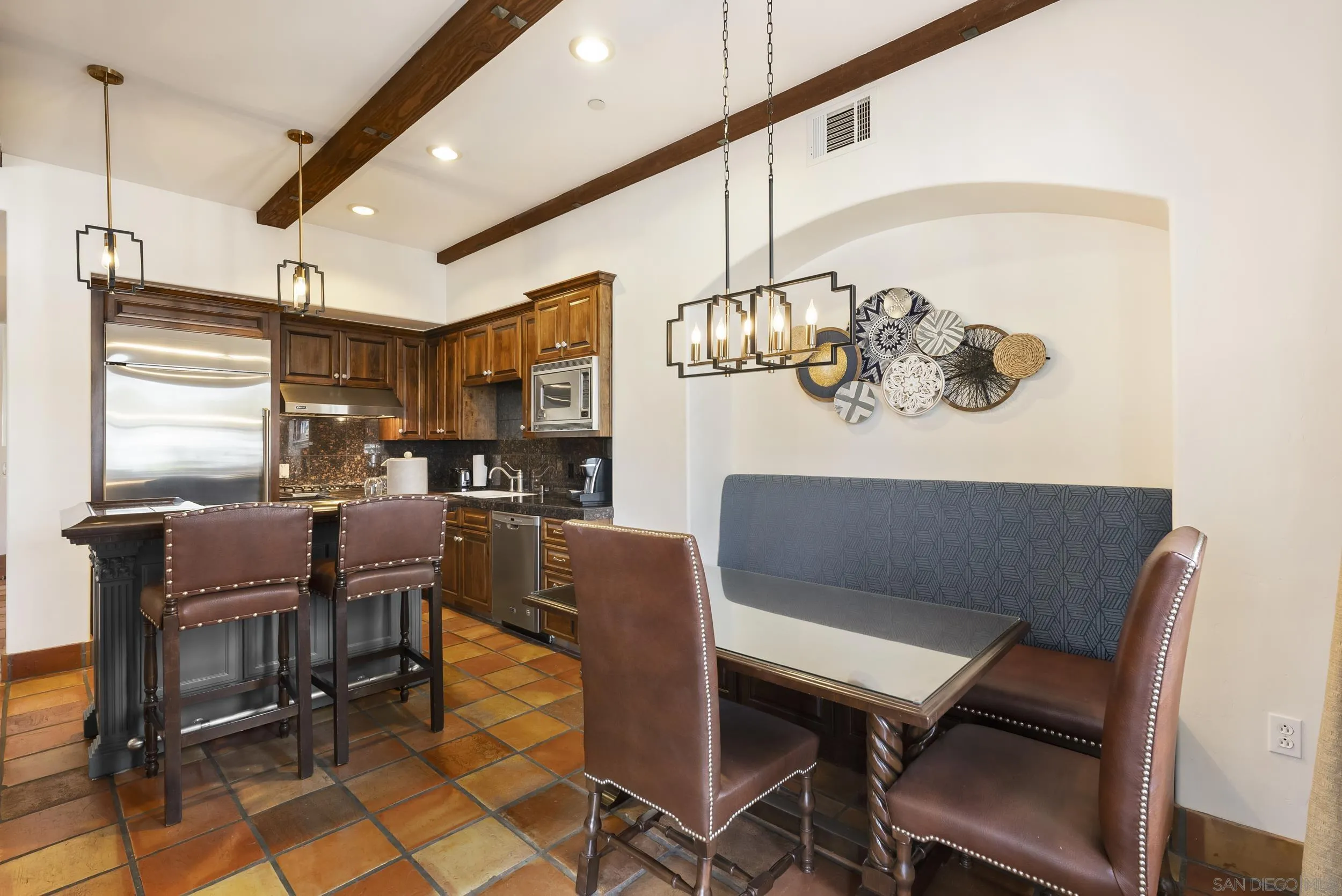 7310 Estrella De Mar Road, Unit 3 Carlsbad, CA 92009 - Photo 11 of 32 a view of a dining room with furniture