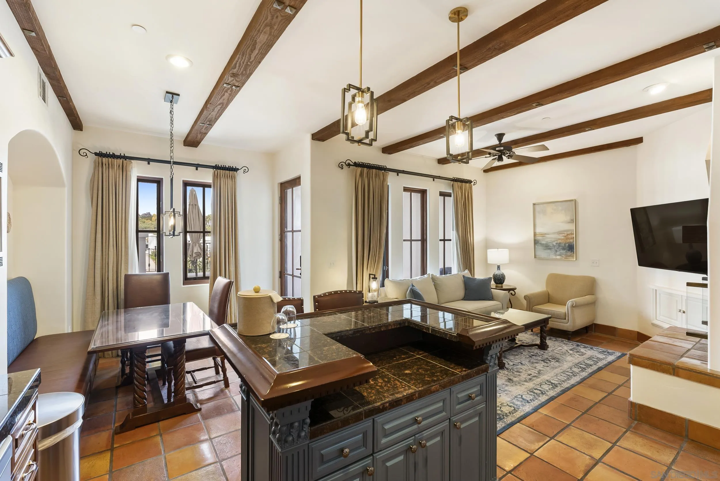 7310 Estrella De Mar Road, Unit 3 Carlsbad, CA 92009 - Photo 13 of 32 a living room with furniture and a flat screen tv