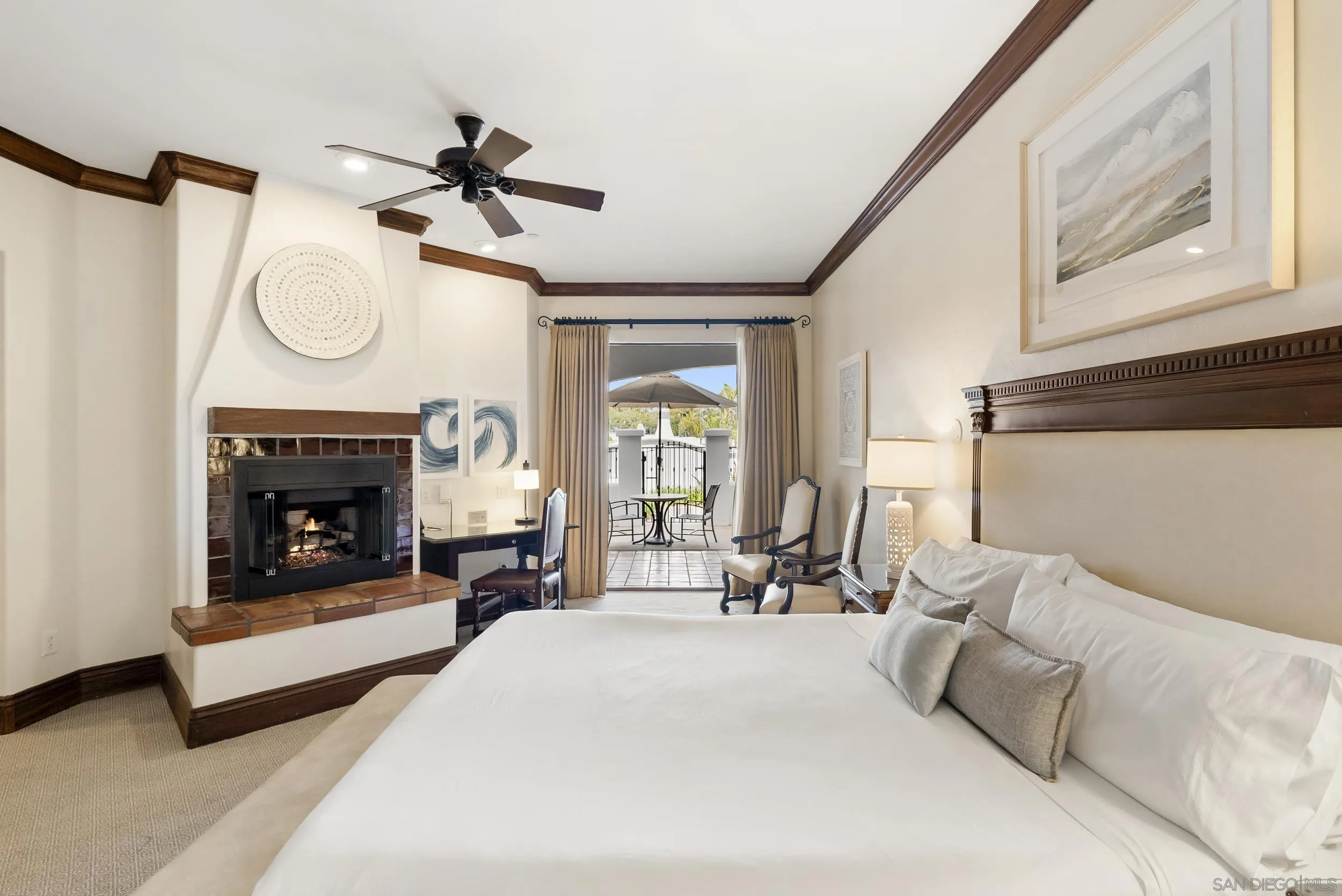 7310 Estrella De Mar Road, Unit 3 Carlsbad, CA 92009 - Photo 16 of 32 a living room with furniture a fireplace and a chandelier