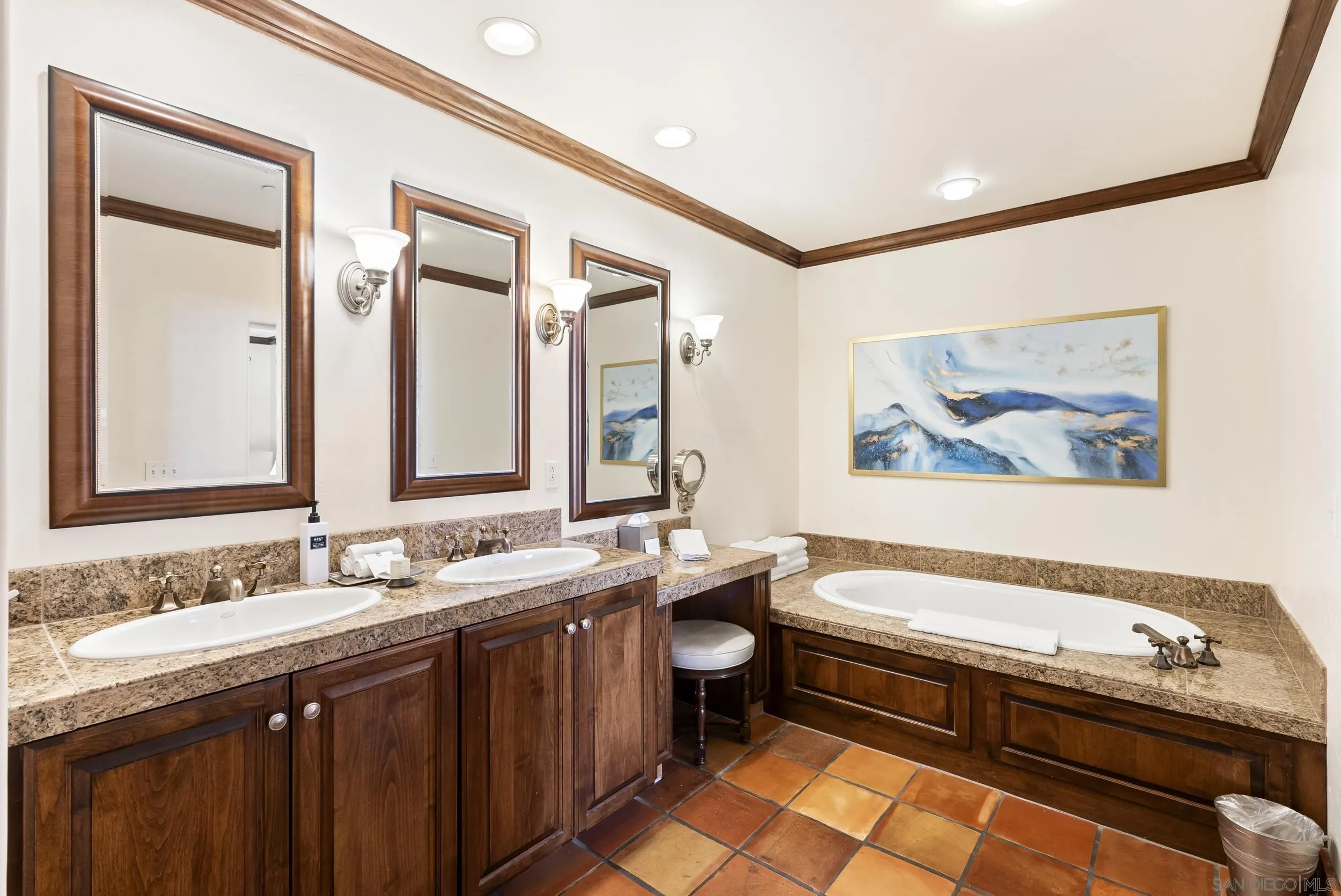 7310 Estrella De Mar Road, Unit 3 Carlsbad, CA 92009 - Photo 23 of 32 a spacious bathroom with a granite countertop tub a double vanity sink and a mirror
