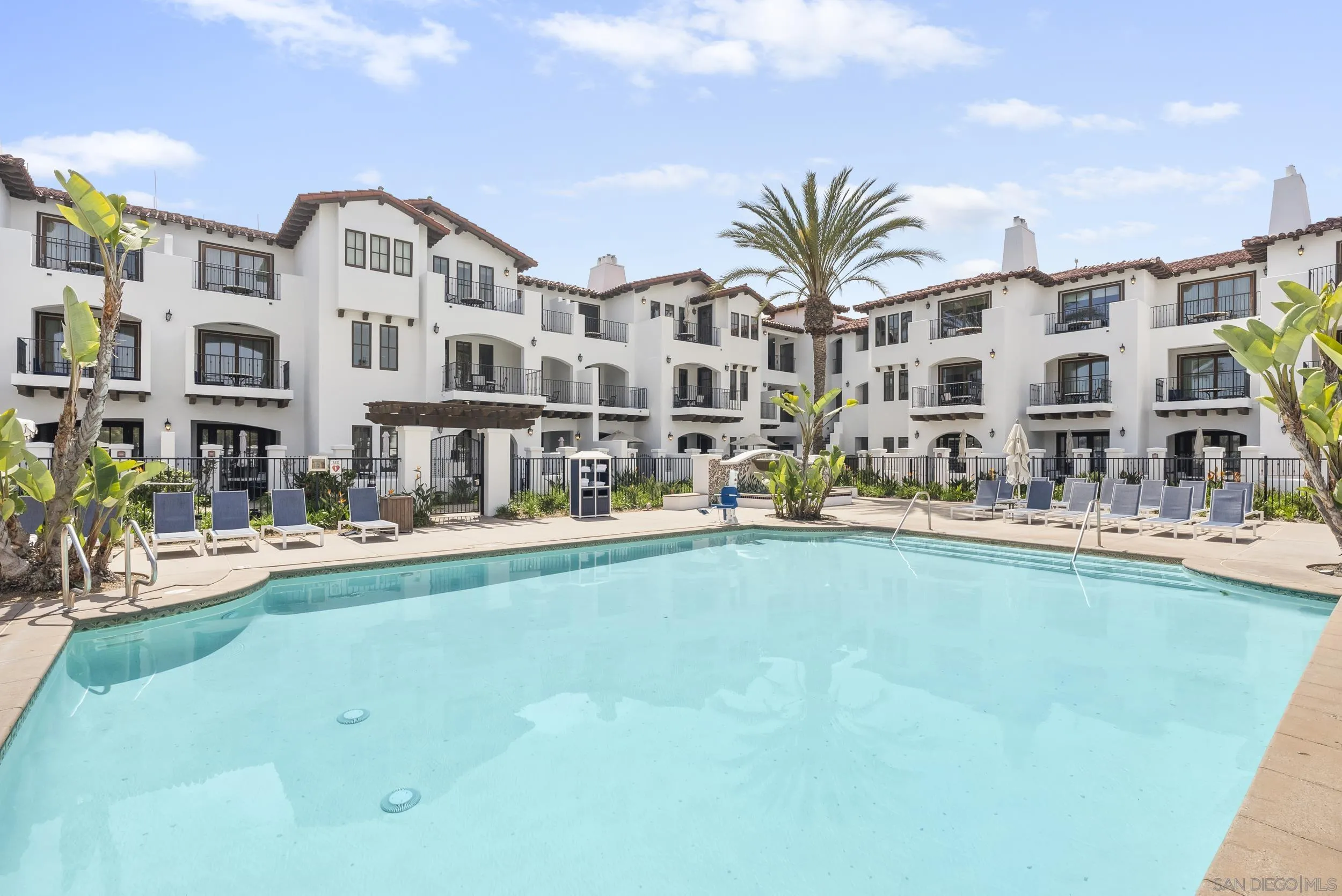 7310 Estrella De Mar Road, Unit 3 Carlsbad, CA 92009 - Photo 26 of 32 a view of building with outdoor space and seating area