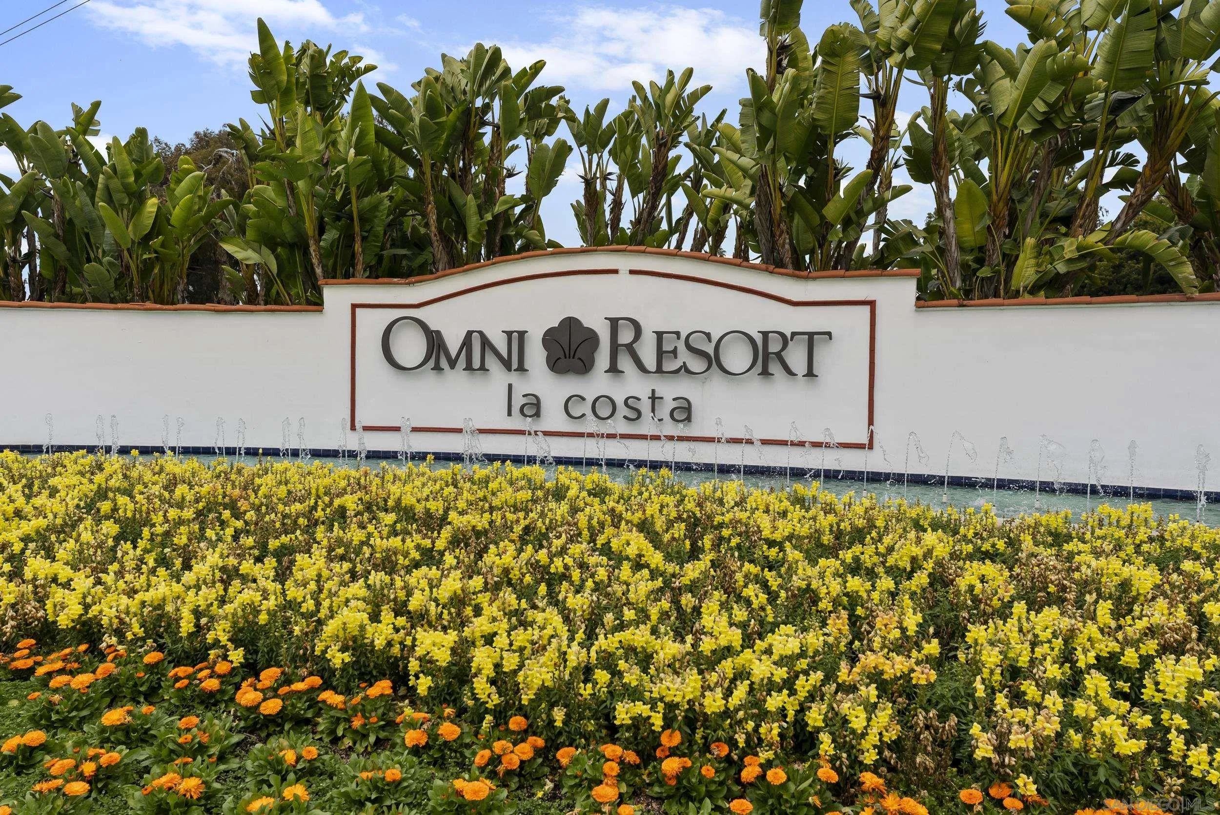 7310 Estrella De Mar Road, Unit 3 Carlsbad, CA 92009 - Photo 28 of 32 a sign that is on a brick wall