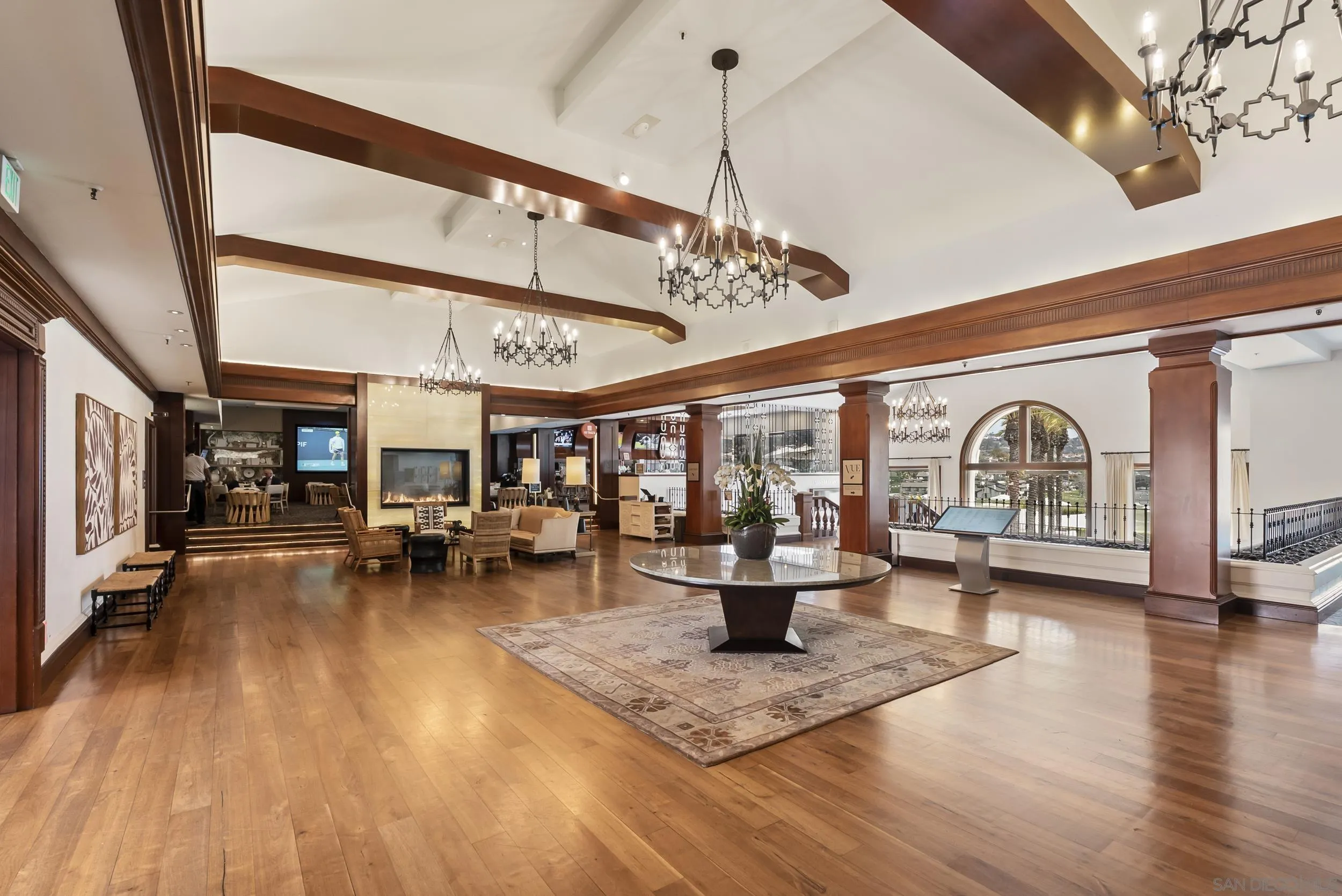 7310 Estrella De Mar Road, Unit 3 Carlsbad, CA 92009 - Photo 29 of 32 a living room with furniture and a chandelier