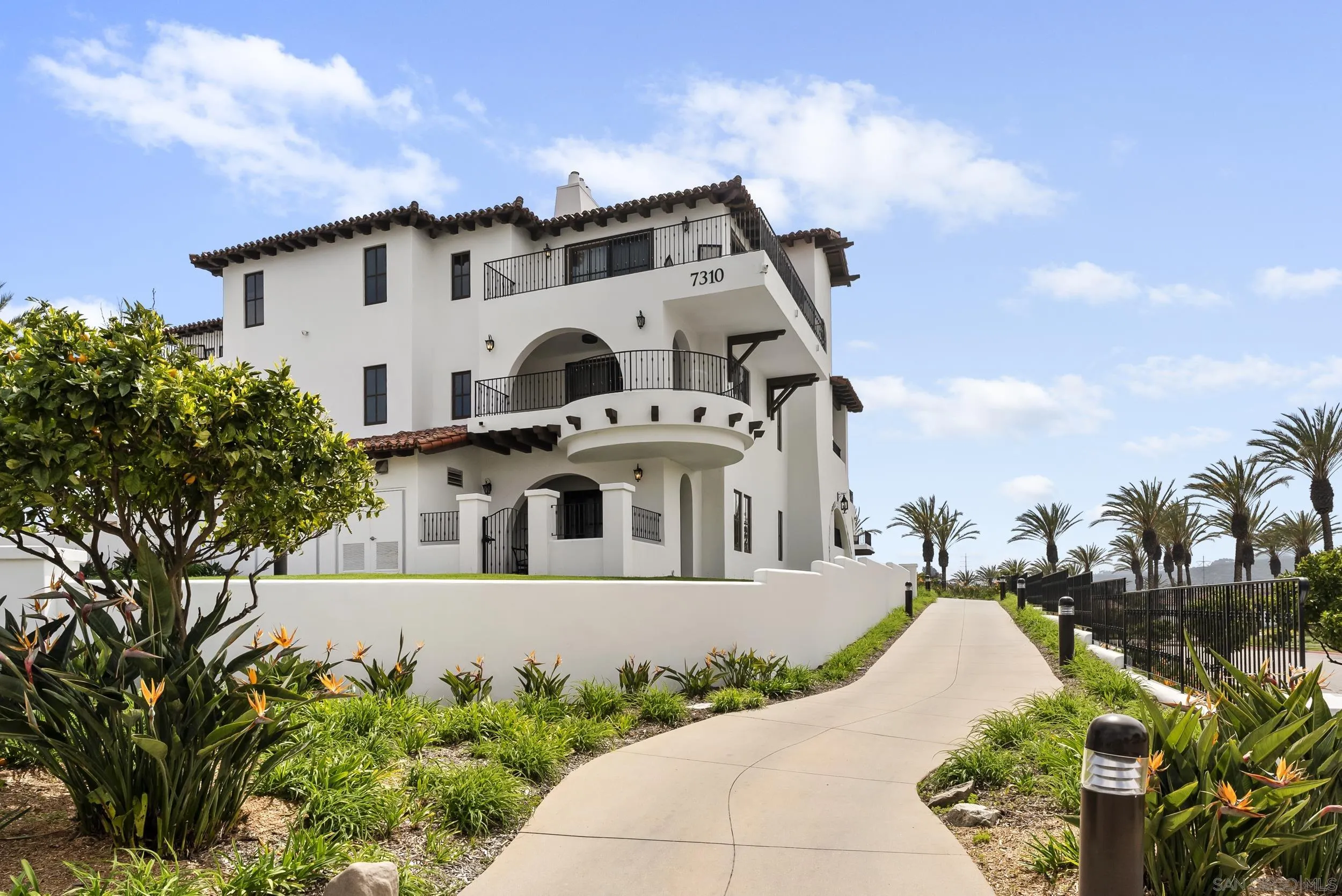 7310 Estrella De Mar Road, Unit 3 Carlsbad, CA 92009 - Photo 3 of 32 a view of a house with a garden