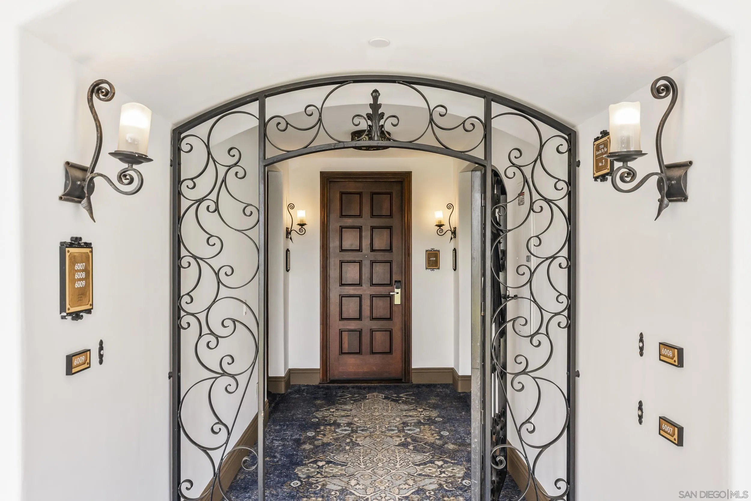 7310 Estrella De Mar Road, Unit 3 Carlsbad, CA 92009 - Photo 4 of 32 a view of a door and a window