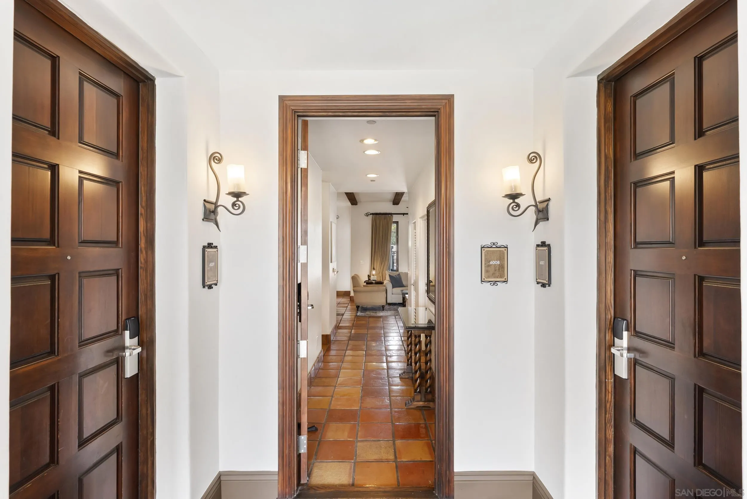 7310 Estrella De Mar Road, Unit 3 Carlsbad, CA 92009 - Photo 5 of 32 a view of a hallway with living room and dining room view