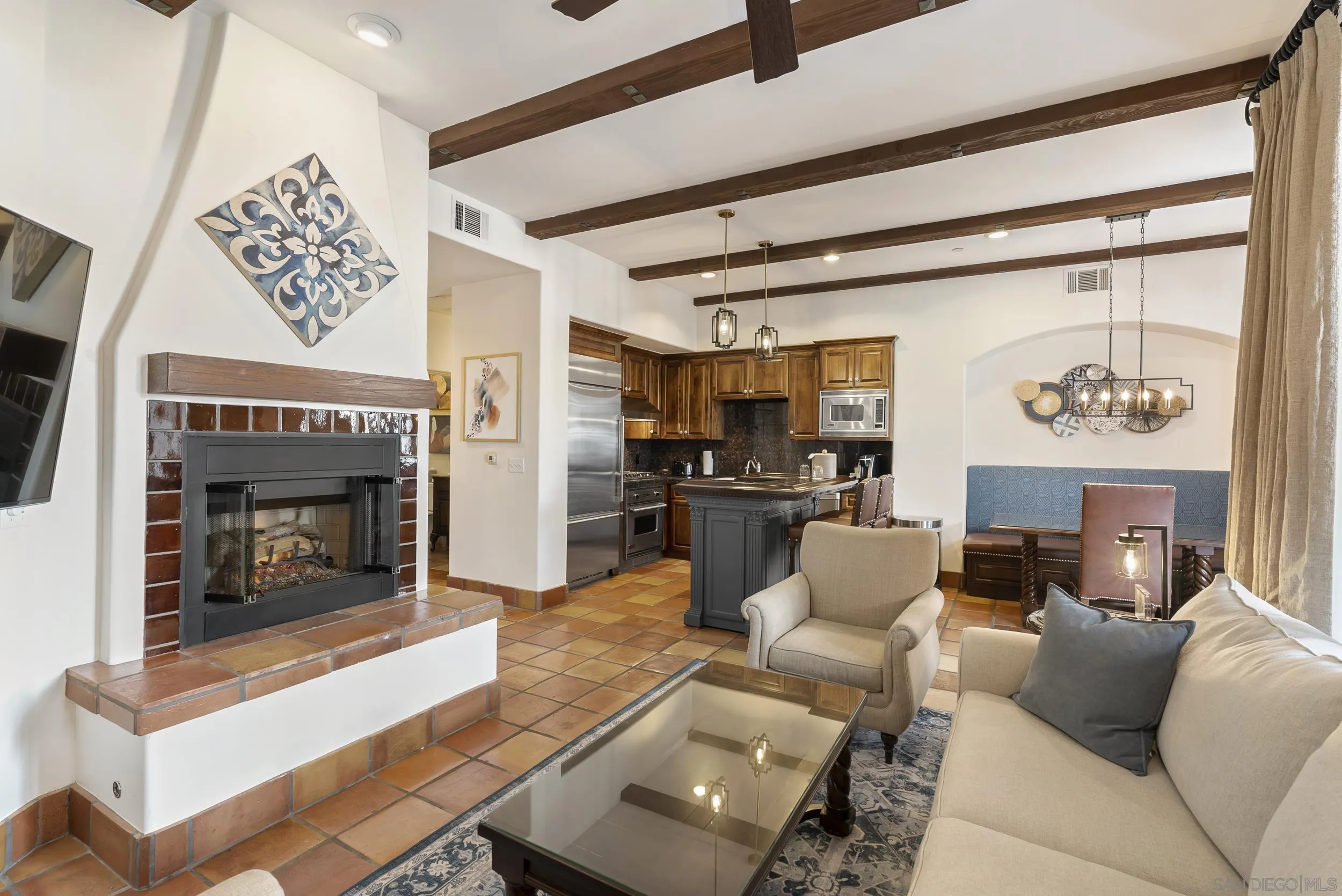 7310 Estrella De Mar Road, Unit 3 Carlsbad, CA 92009 - Photo 8 of 32 a living room with furniture and a fireplace