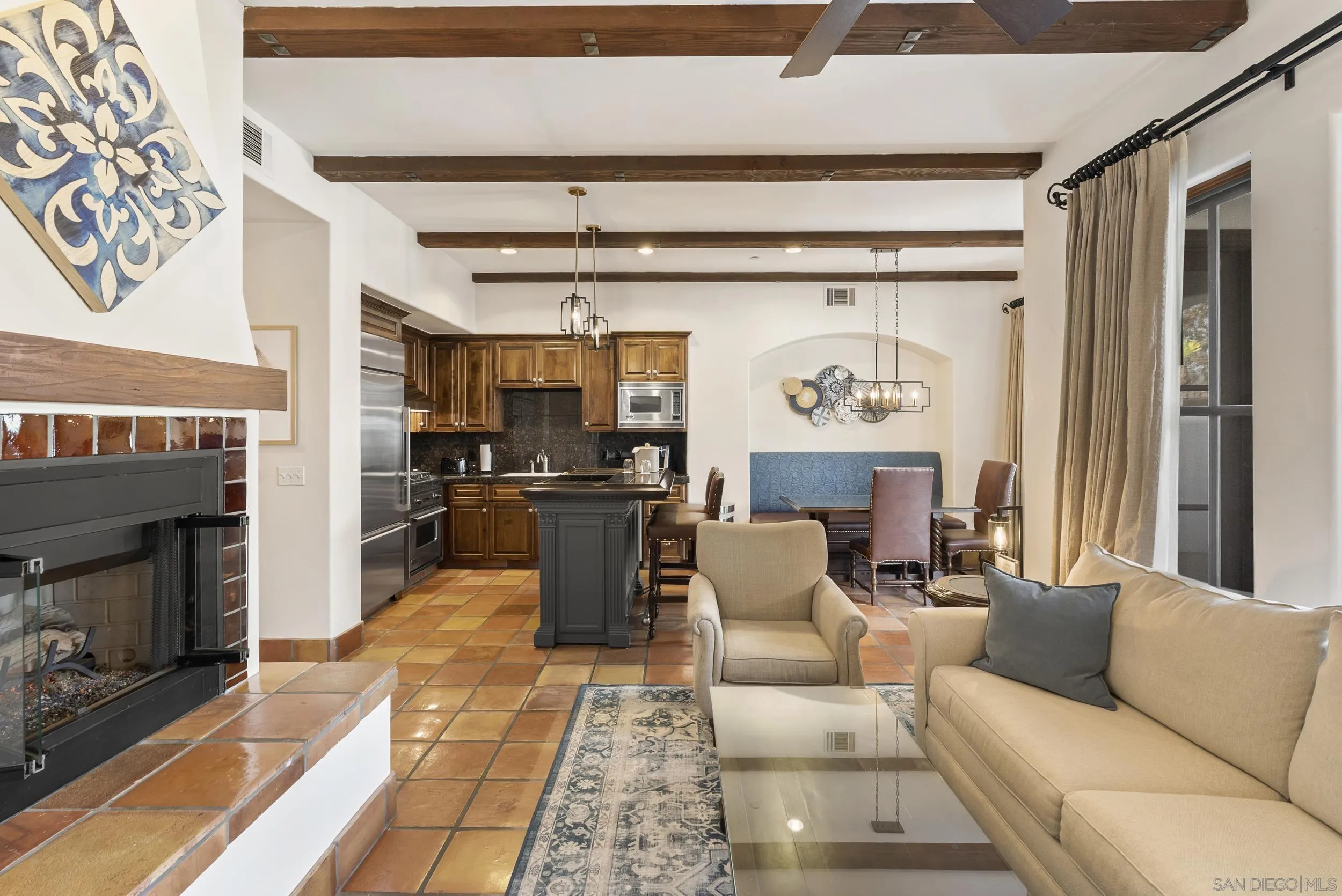 7310 Estrella De Mar Road, Unit 3 Carlsbad, CA 92009 - Photo 9 of 32 a living room with furniture and a fireplace