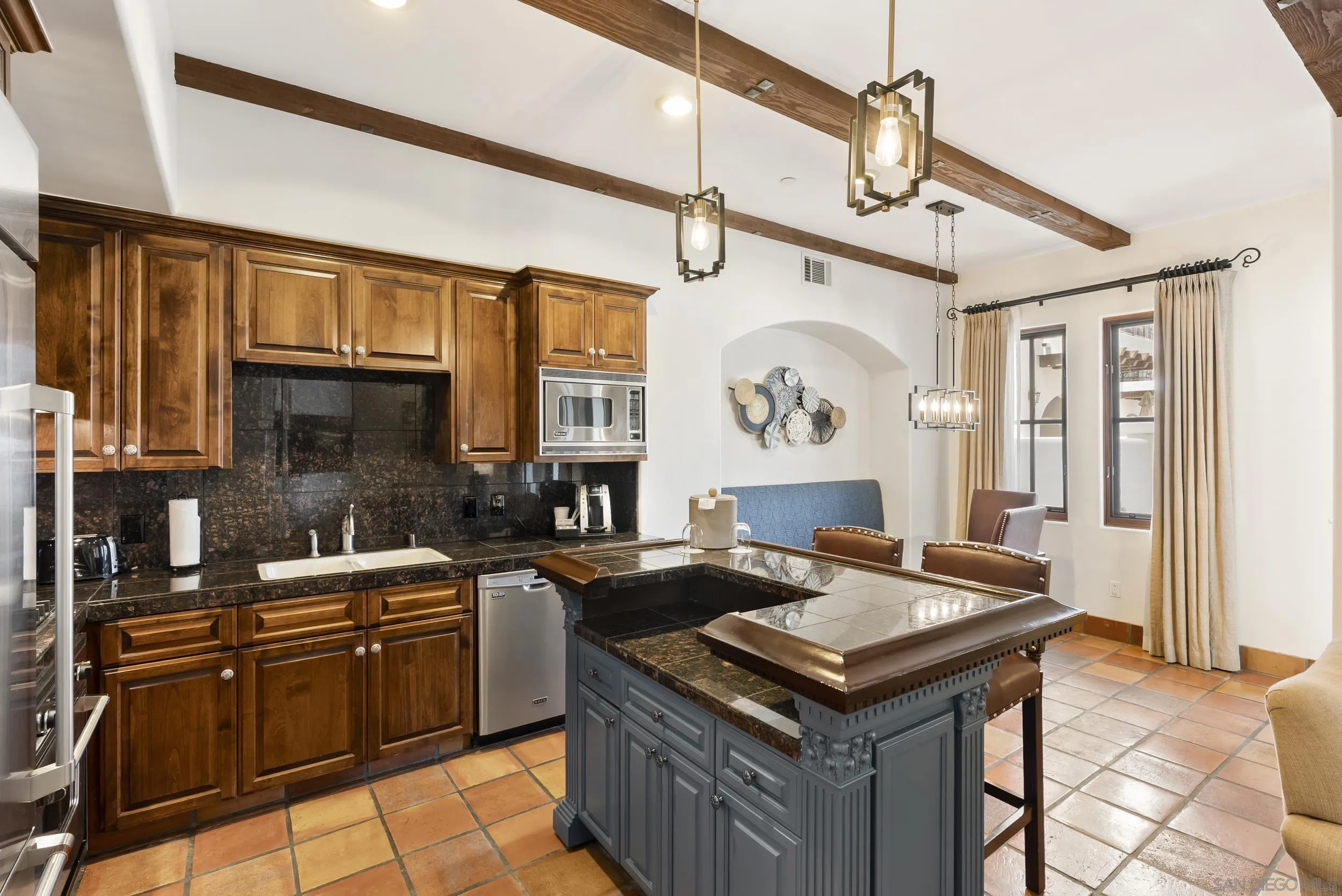 7310 Estrella De Mar Road, Unit 3 Carlsbad, CA 92009 - Photo 10 of 32 a kitchen with stainless steel appliances granite countertop a sink stove and refrigerator