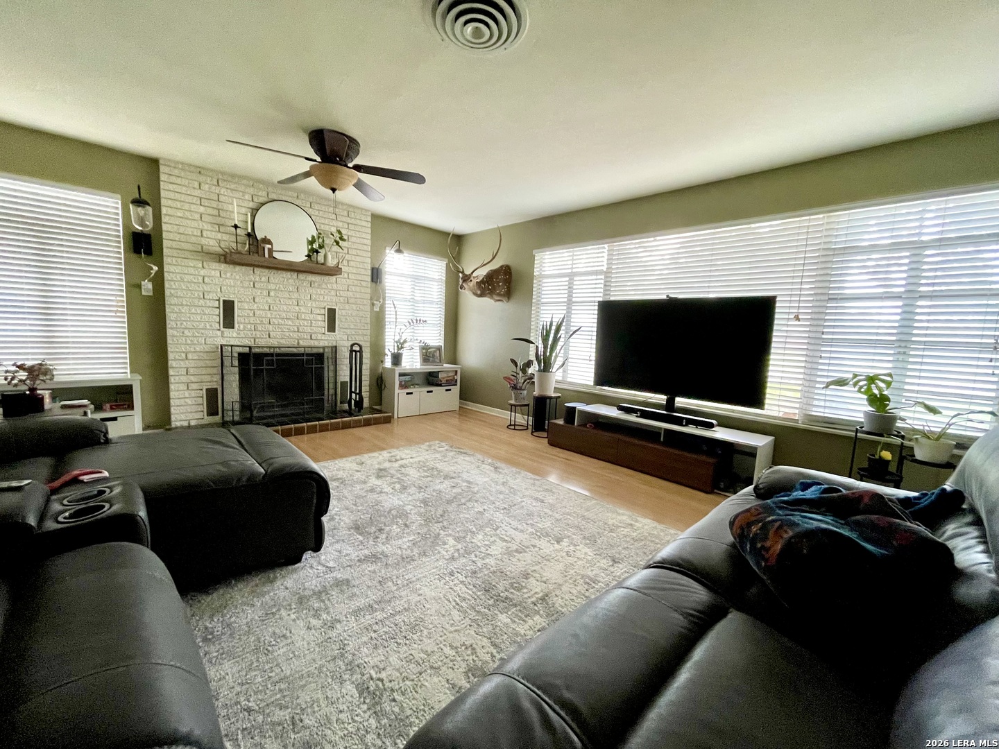 803 Cherry Street Uvalde, TX 78801 - Photo 15 of 17 a living room with furniture and a flat screen tv