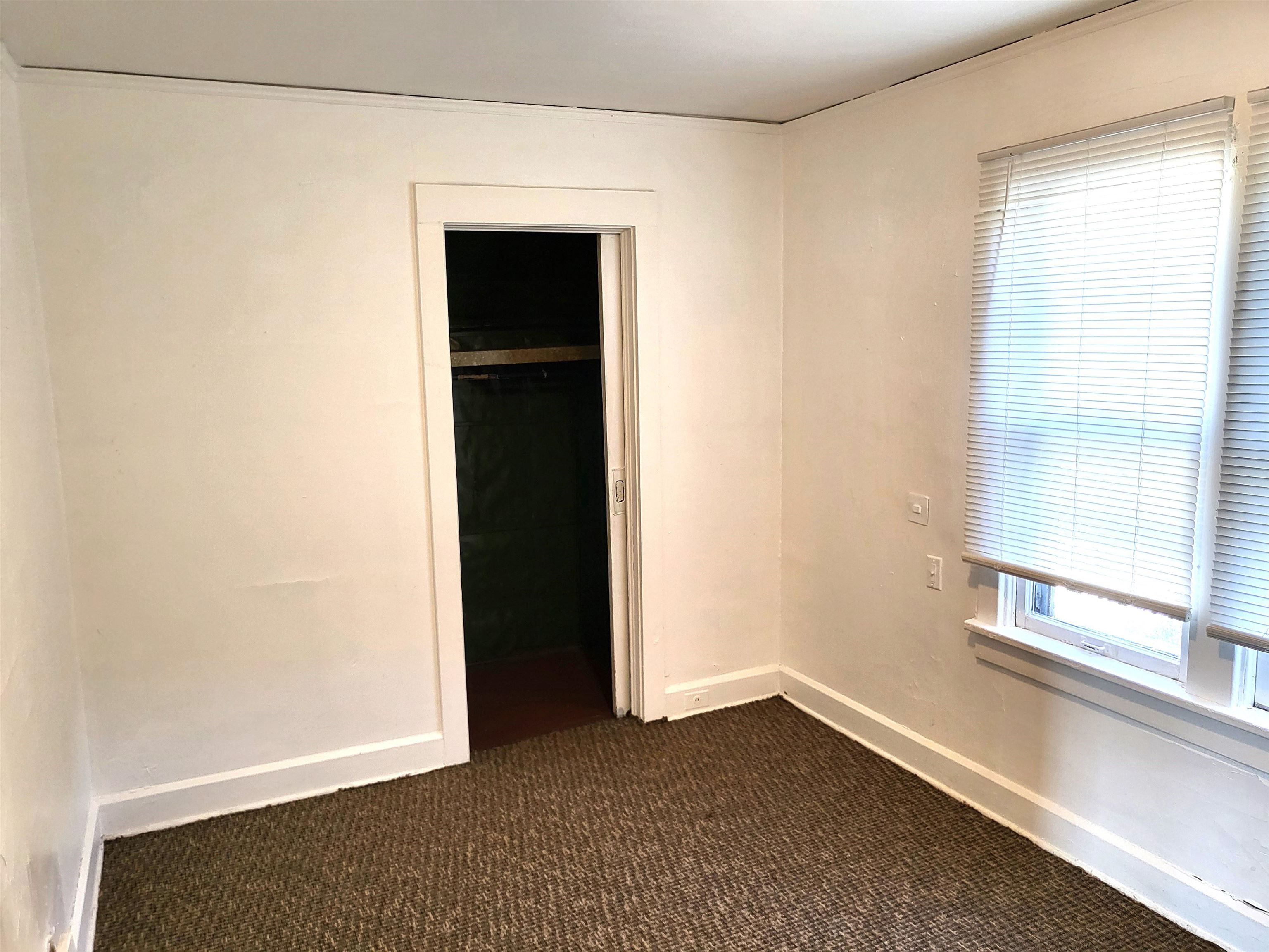 1433 5th Avenue Rockford, IL 61104 - Photo 12 of 19 a view of an empty room with a window