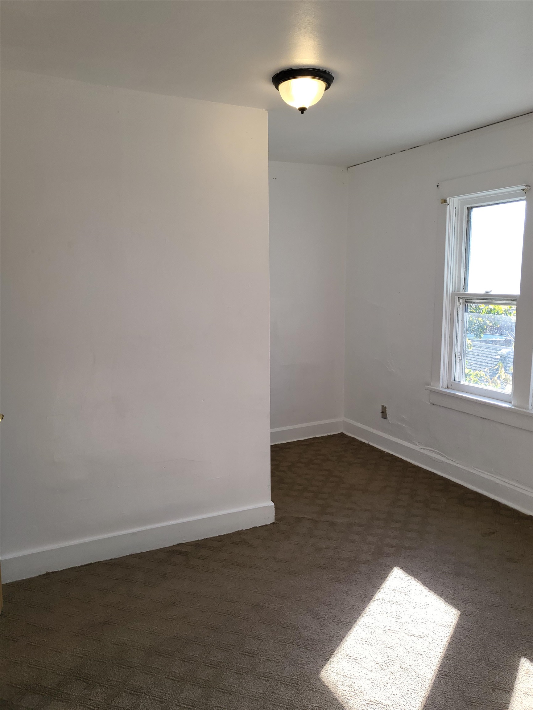 1433 5th Avenue Rockford, IL 61104 - Photo 15 of 19 an empty room with a window