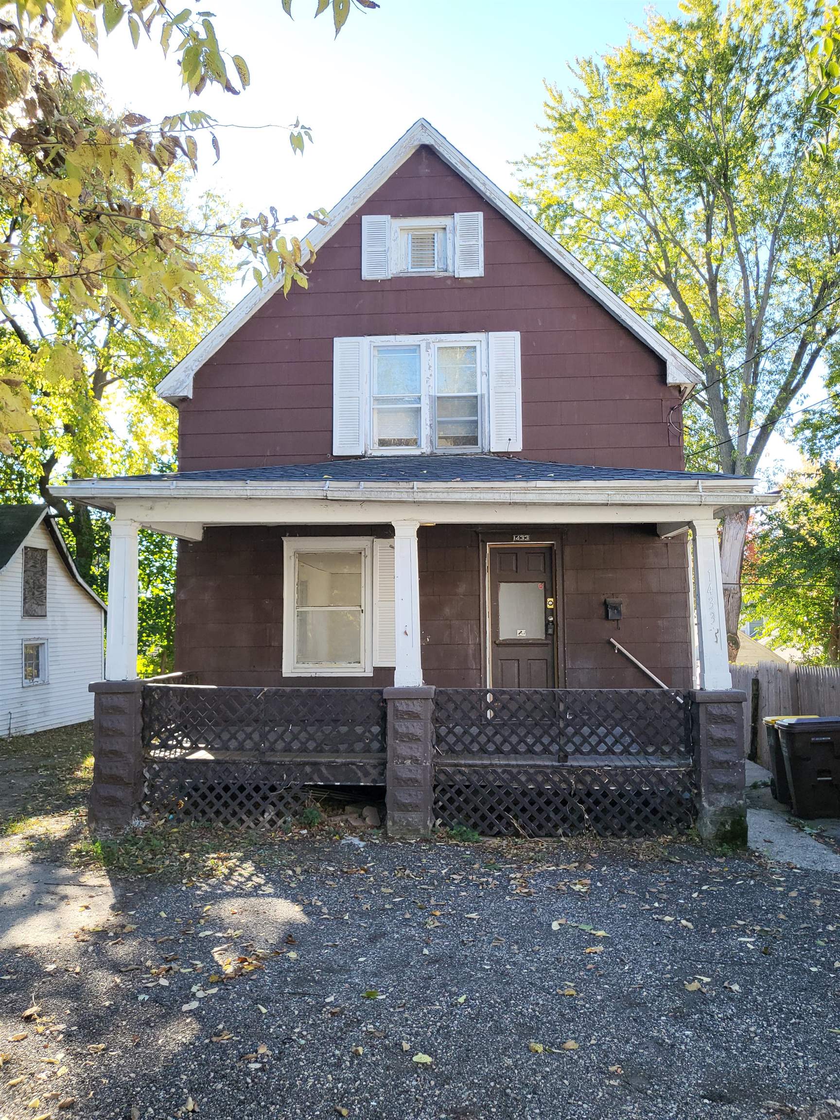 1433 5th Avenue Rockford, IL 61104 - Photo 3 of 19 a front view of a house with garden