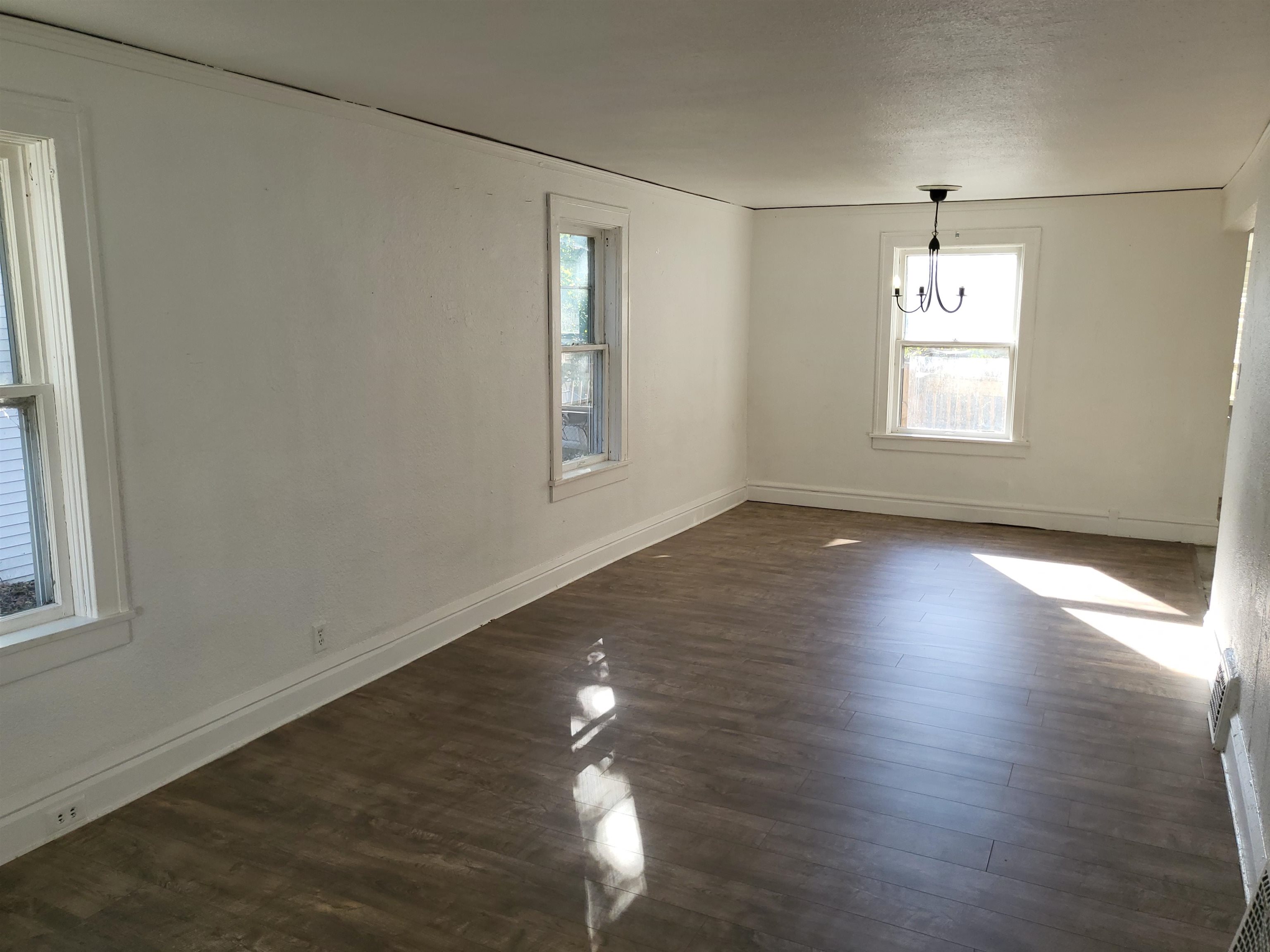 1433 5th Avenue Rockford, IL 61104 - Photo 8 of 19 wooden floor in an empty room with a window