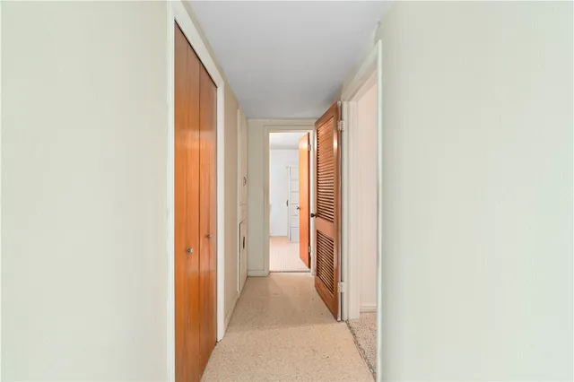 a view of a hallway with a white walls