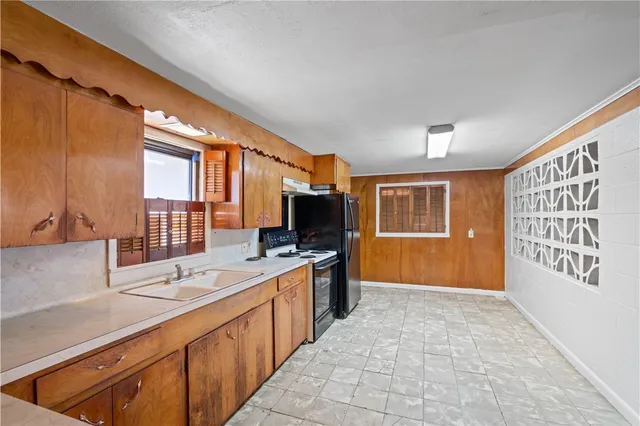 a large kitchen with a large window