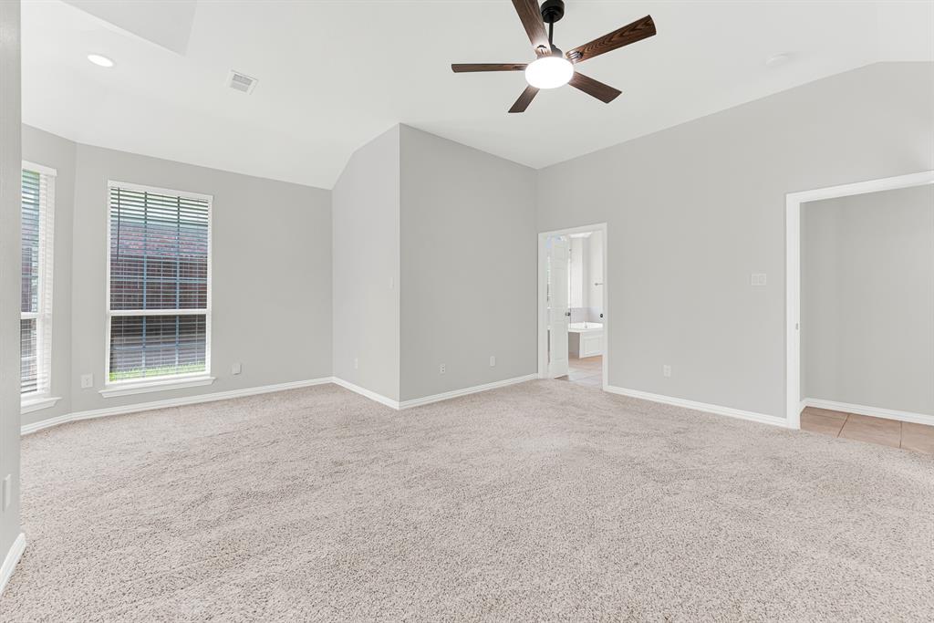 3500 Neiman Road Plano, TX 75025 - Photo 5 of 26 Like the other rooms in this home, the primary bedroom is large, and will easily accommodate any size and style of furniture.