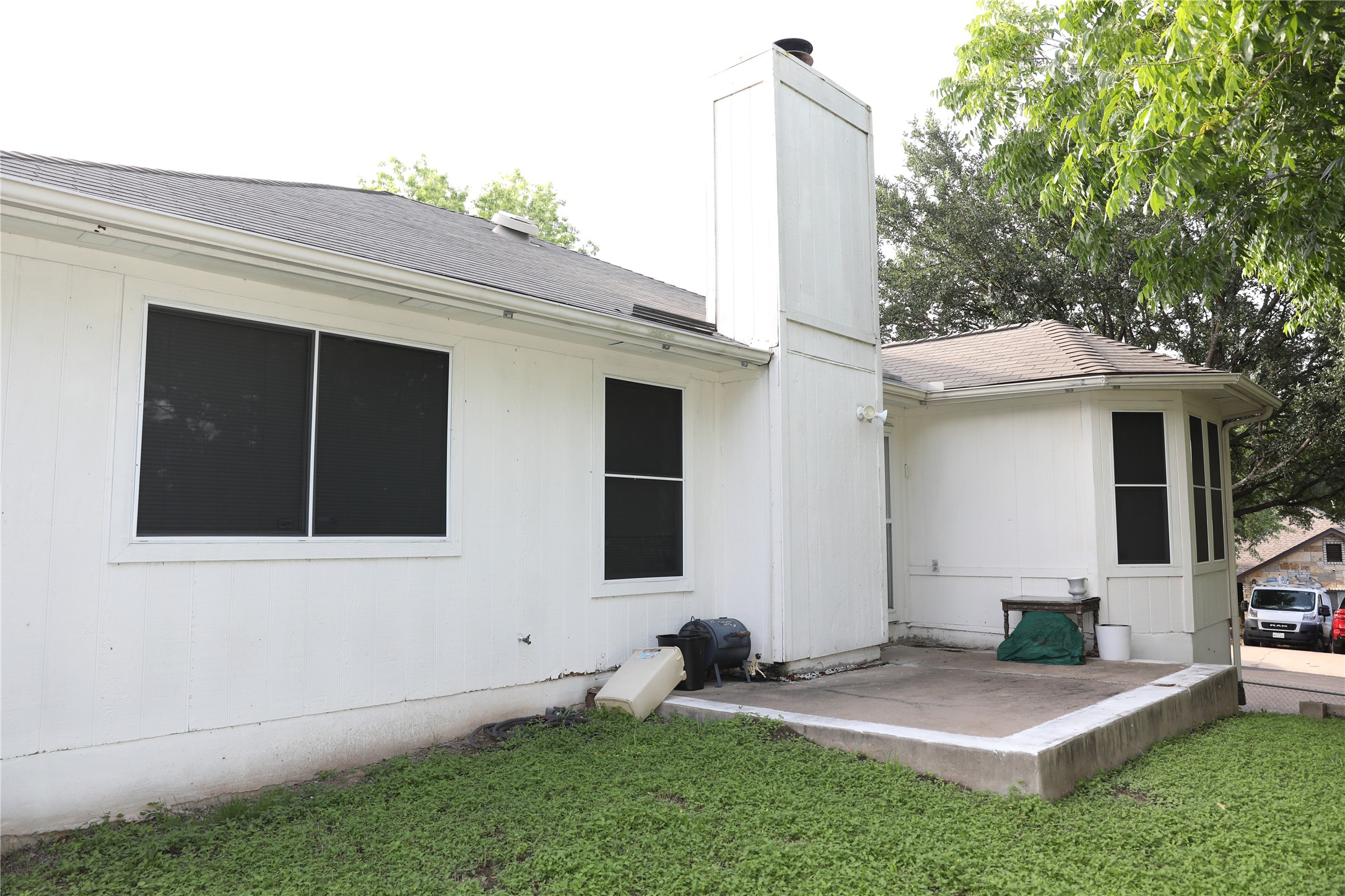 4901 Birch Creek Road Austin, TX 78744 - Photo 10 of 11 A private concrete patio extends from the home, perfect for outdoor relaxation.