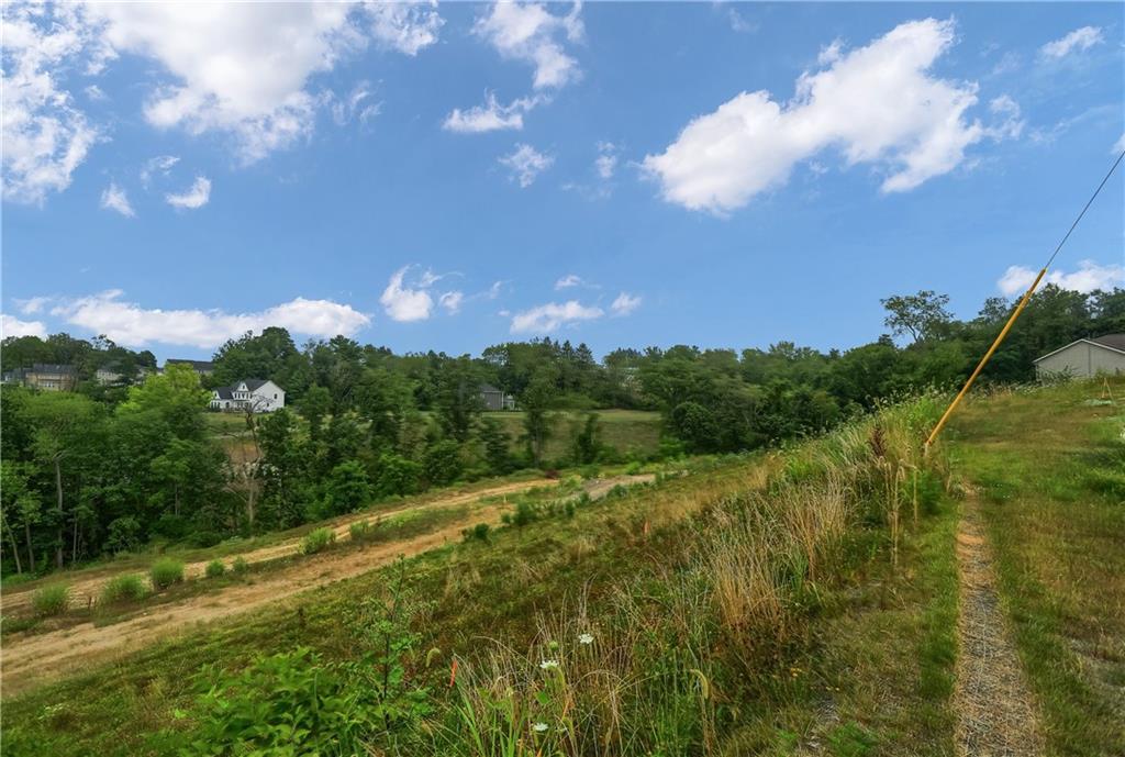 Lot 6 Beaver Grade Road McKees Rocks, PA 15136 - Photo 2 of 12 a view of a big yard with lots of green space and mountain view in back