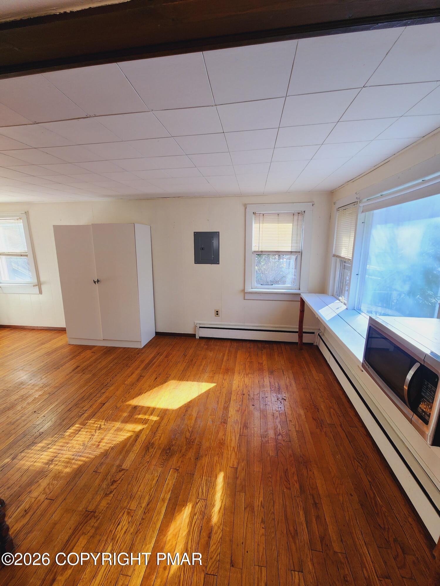 873 Lower Swiftwater Road, Unit 201 Cresco, PA 18326 - Photo 4 of 10 a view of a room with wooden floor and window