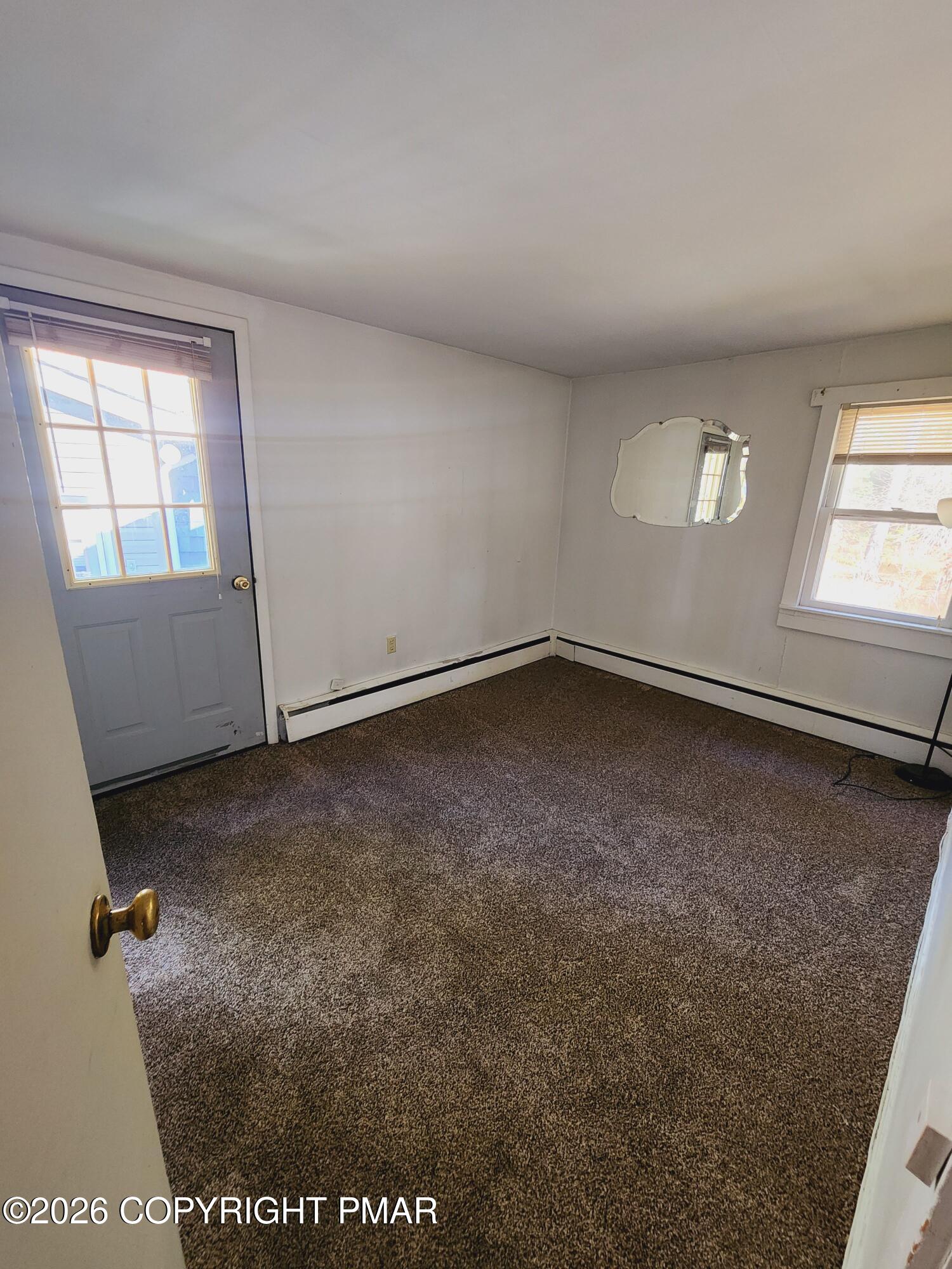 873 Lower Swiftwater Road, Unit 201 Cresco, PA 18326 - Photo 8 of 10 an empty room with windows
