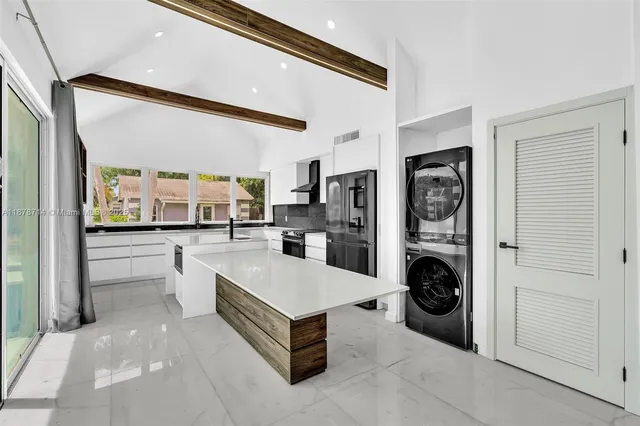 a view of a living room and entry way