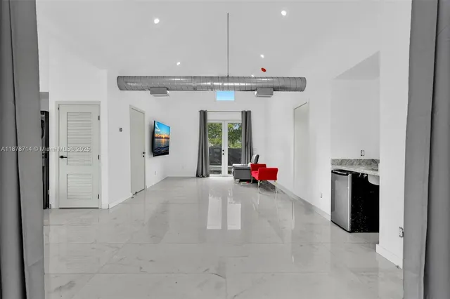 a view of a livingroom with furniture and windows