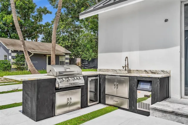 a view of house with swimming pool and outdoor seating