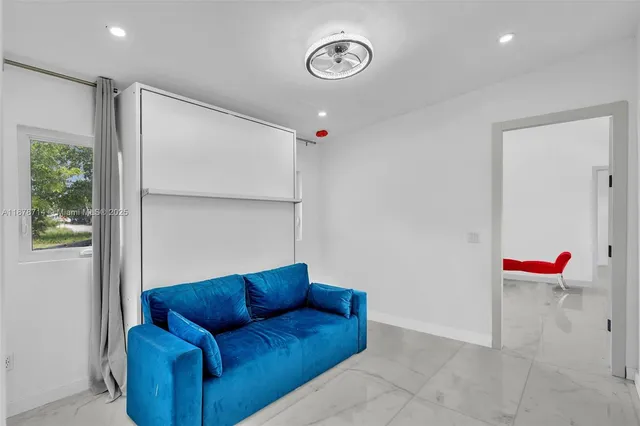 an aerial view of residential houses with yard