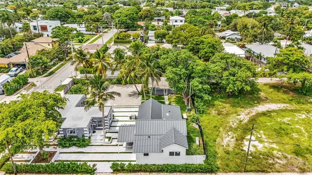an aerial view of residential building and car parked