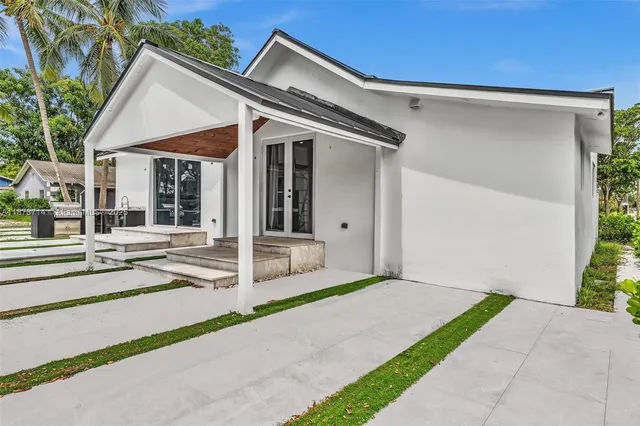 a front view of a house with a garage