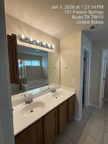 en empty room with ceiling fan and window