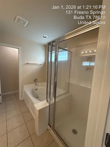 a view of a livingroom with an empty space and a window