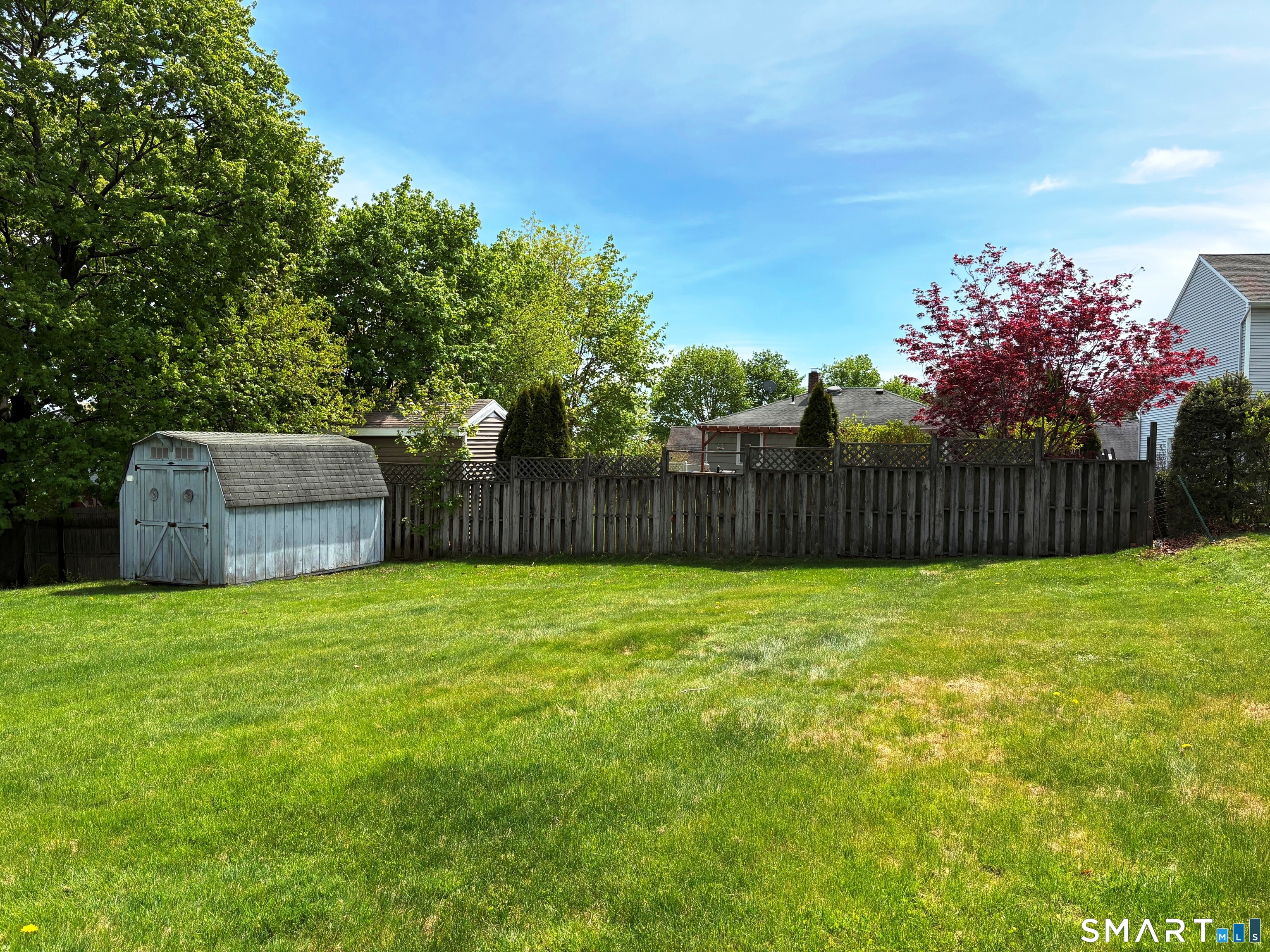 20 Garibaldi Street Watertown, CT 06779 - Photo 16 of 16 a view of a backyard with a garden and deck