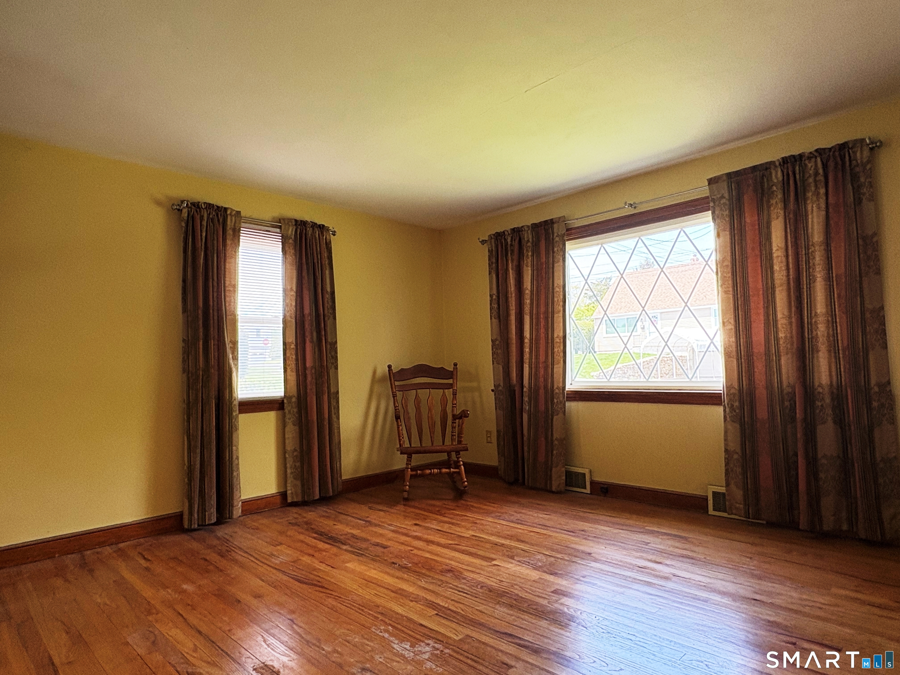 20 Garibaldi Street Watertown, CT 06779 - Photo 2 of 16 an empty room with wooden floor and windows