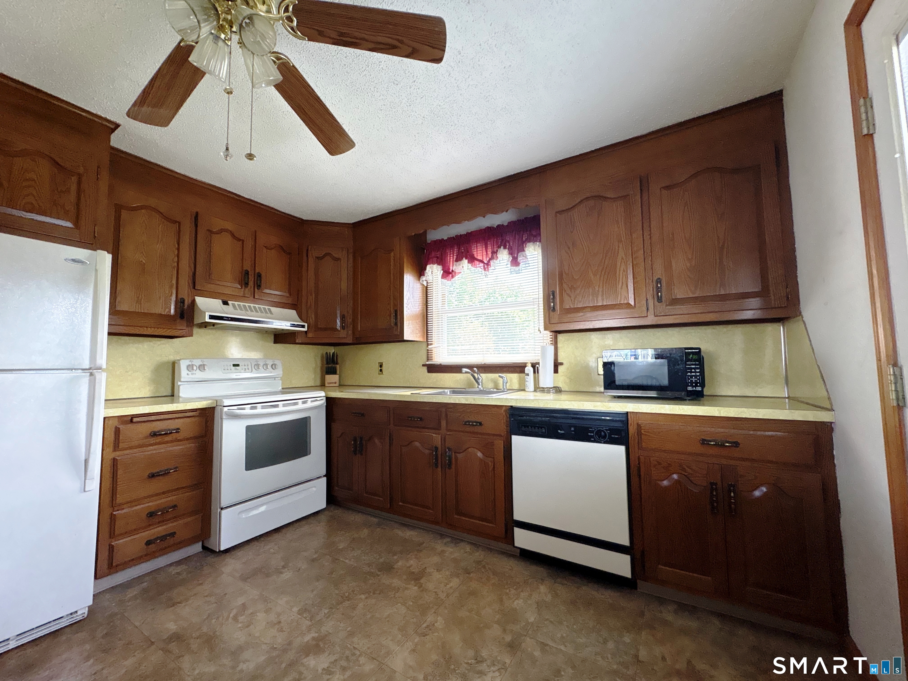 20 Garibaldi Street Watertown, CT 06779 - Photo 4 of 16 a kitchen with granite countertop a sink stainless steel appliances and cabinets