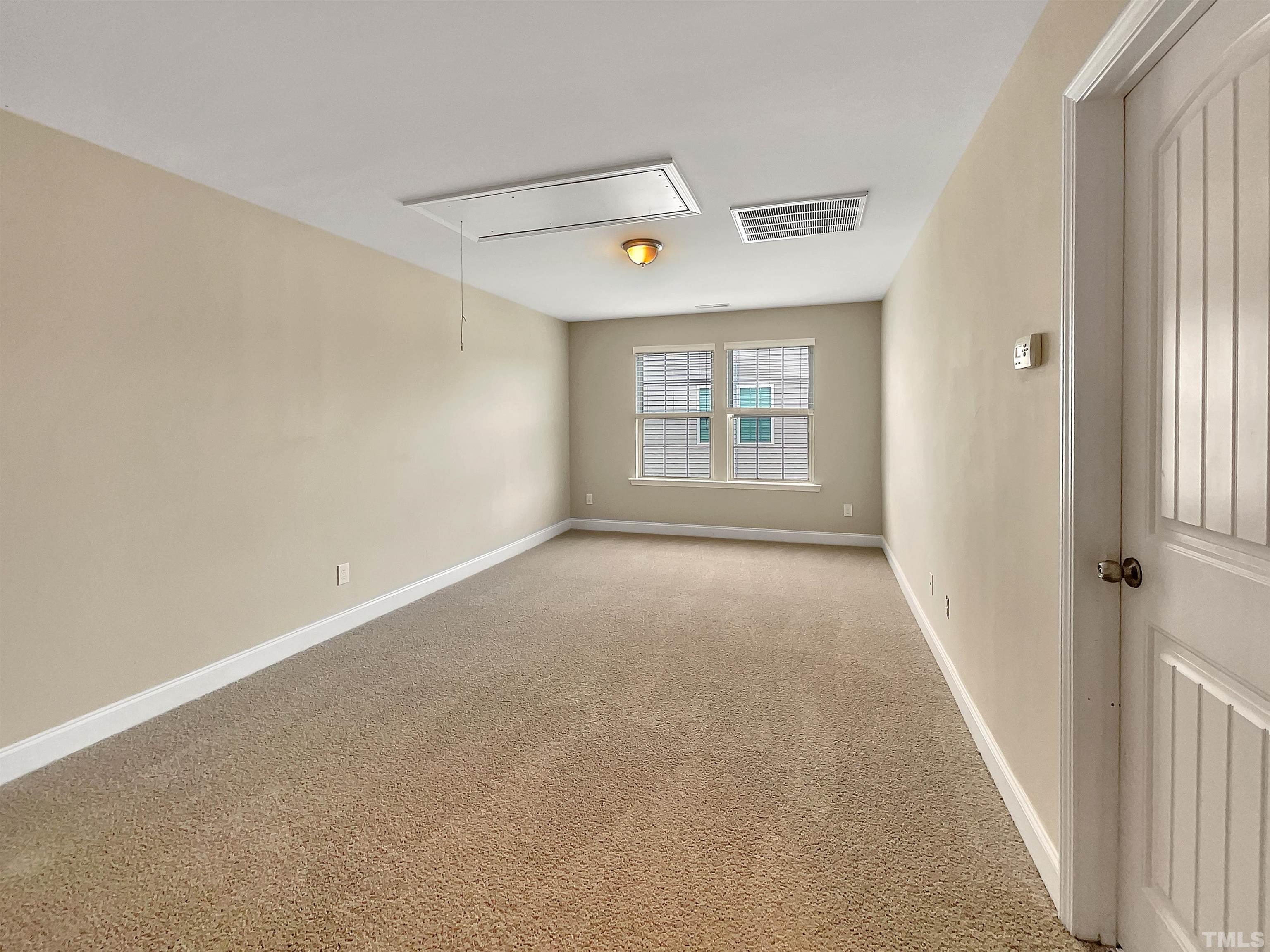 2709 Communion Court Raleigh, NC 27610 - Photo 11 of 18 an empty room with windows