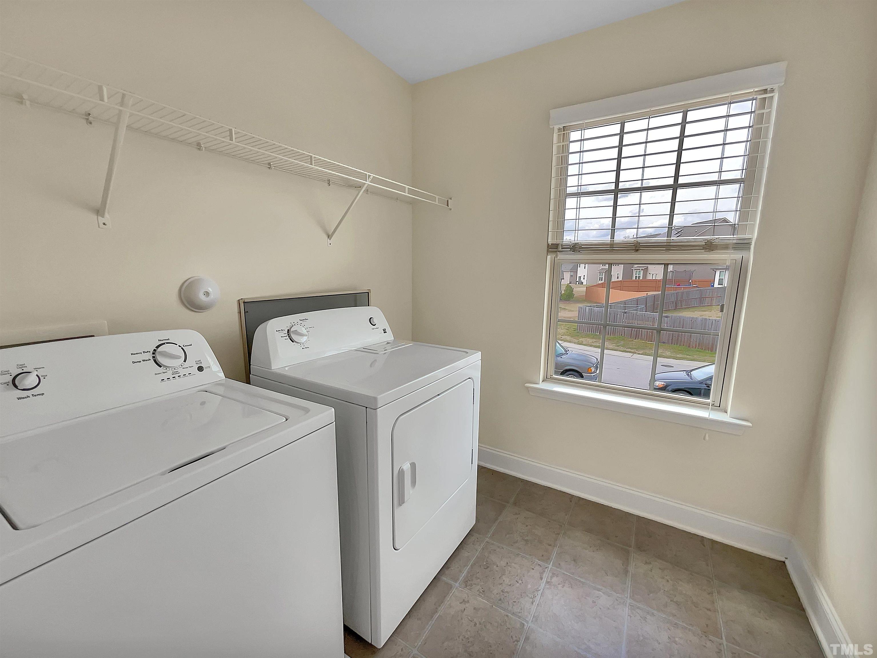 2709 Communion Court Raleigh, NC 27610 - Photo 16 of 18 a utility room with dryer and washer