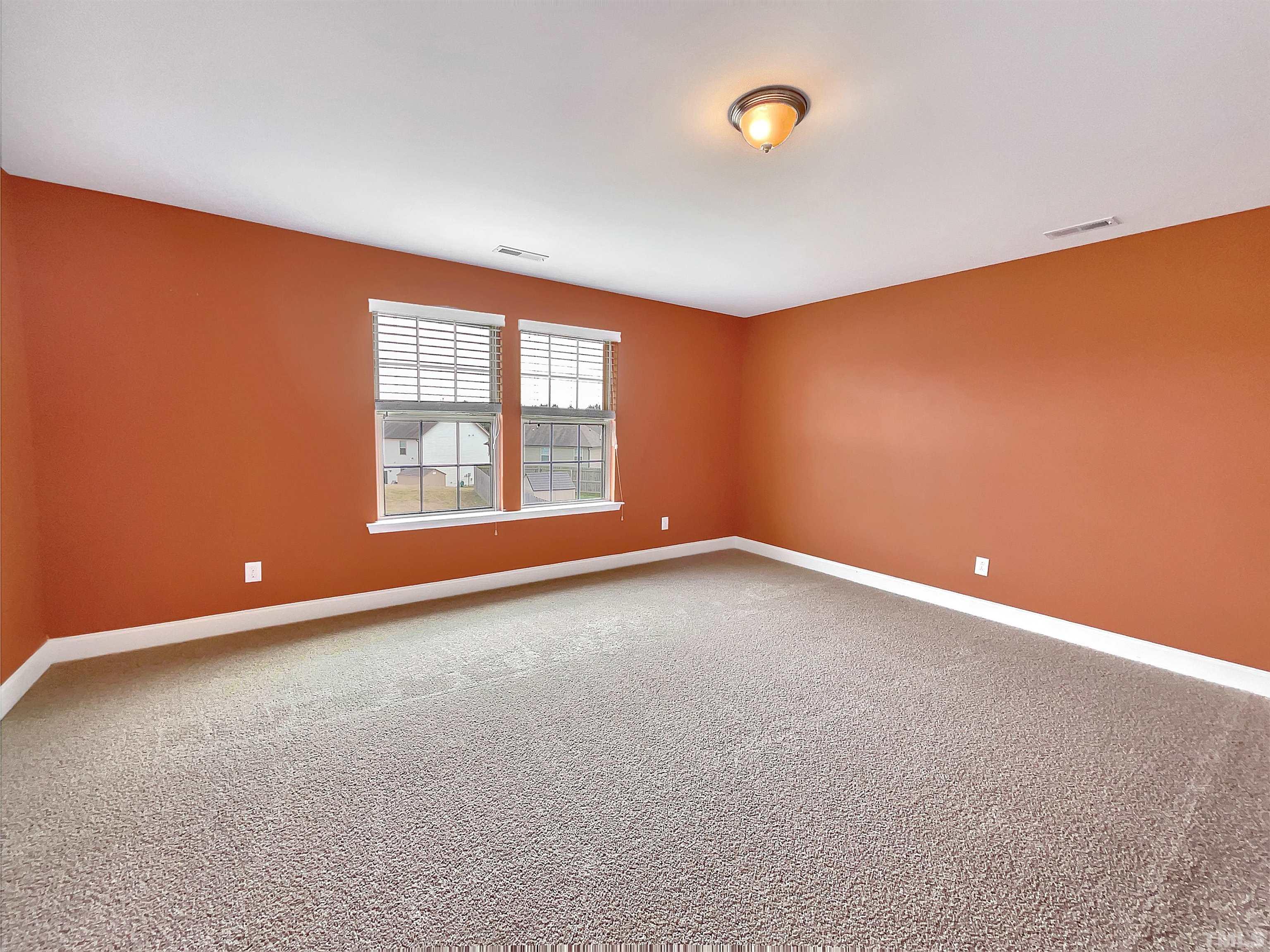 2709 Communion Court Raleigh, NC 27610 - Photo 17 of 18 an empty room with windows