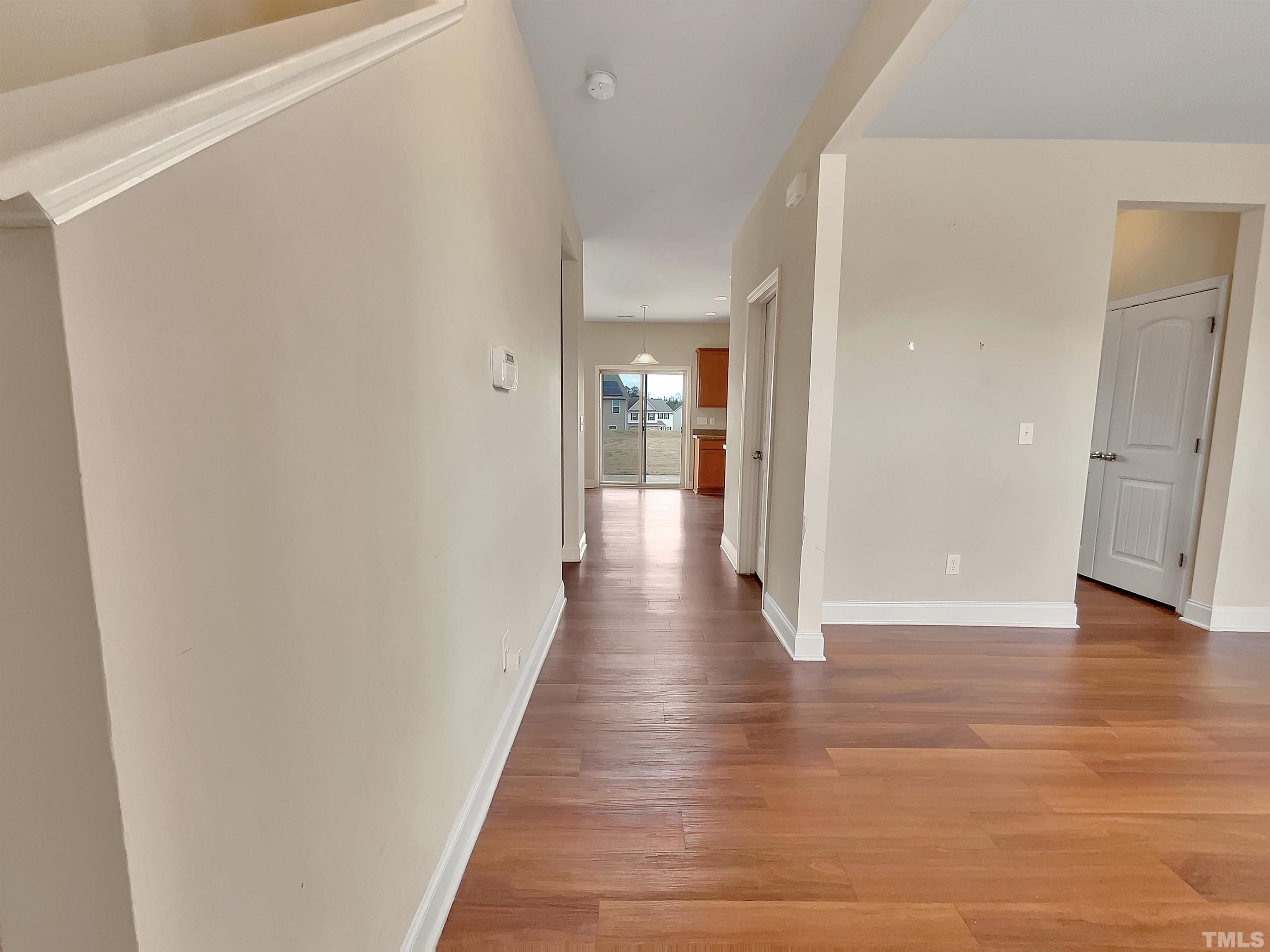 2709 Communion Court Raleigh, NC 27610 - Photo 6 of 18 a view of a hallway with wooden floor