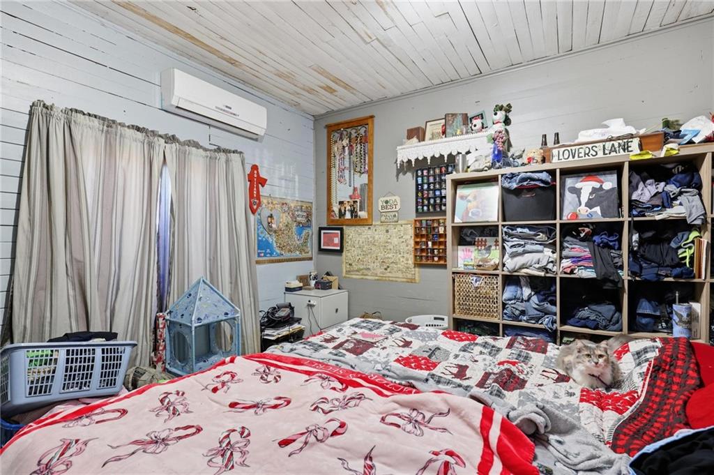 415 Tapley Road Villa Rica, GA 30180 - Photo 16 of 25 a bedroom with a bed and a window