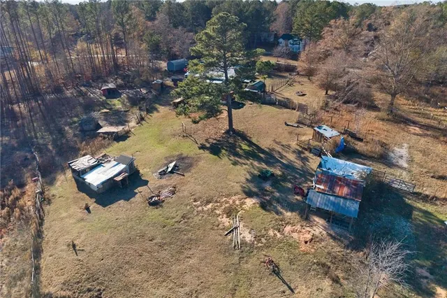 a aerial view of a house with a yard