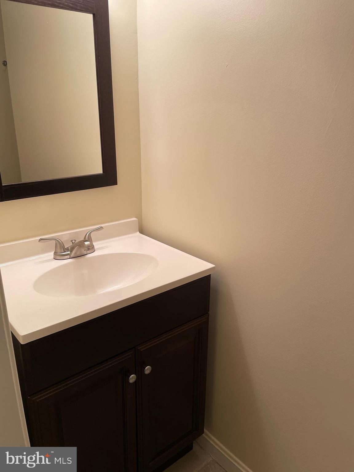 12405 Gooderham Way Gaithersburg, MD 20878 - Photo 25 of 31 a bathroom with a sink and a mirror