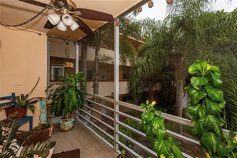 a view of a house with a flower garden