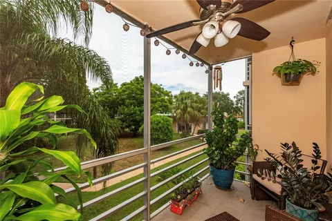 a view of a balcony with potted plants