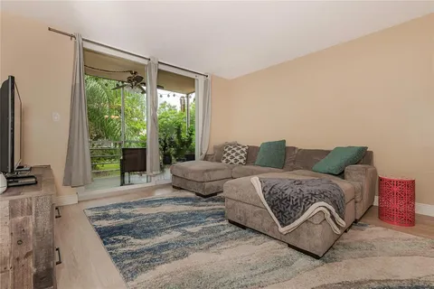 a spacious bedroom with a bed and a large window