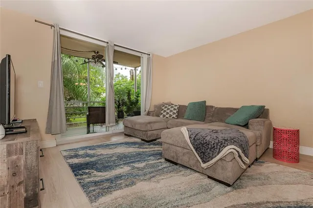 a spacious bedroom with a bed and a large window