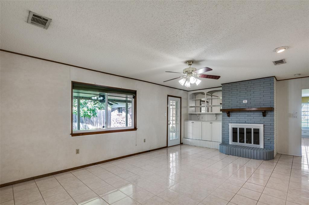 1501 Ridgeview Drive Arlington, TX 76012 - Photo 17 of 32 an empty room with windows and fireplace